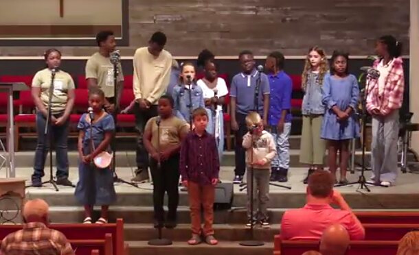 Volunteer serving in Kids Church